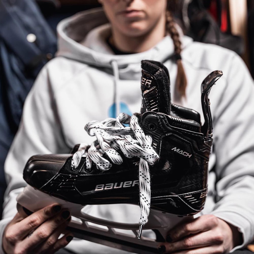 Woman holding a Bauer hockey skate