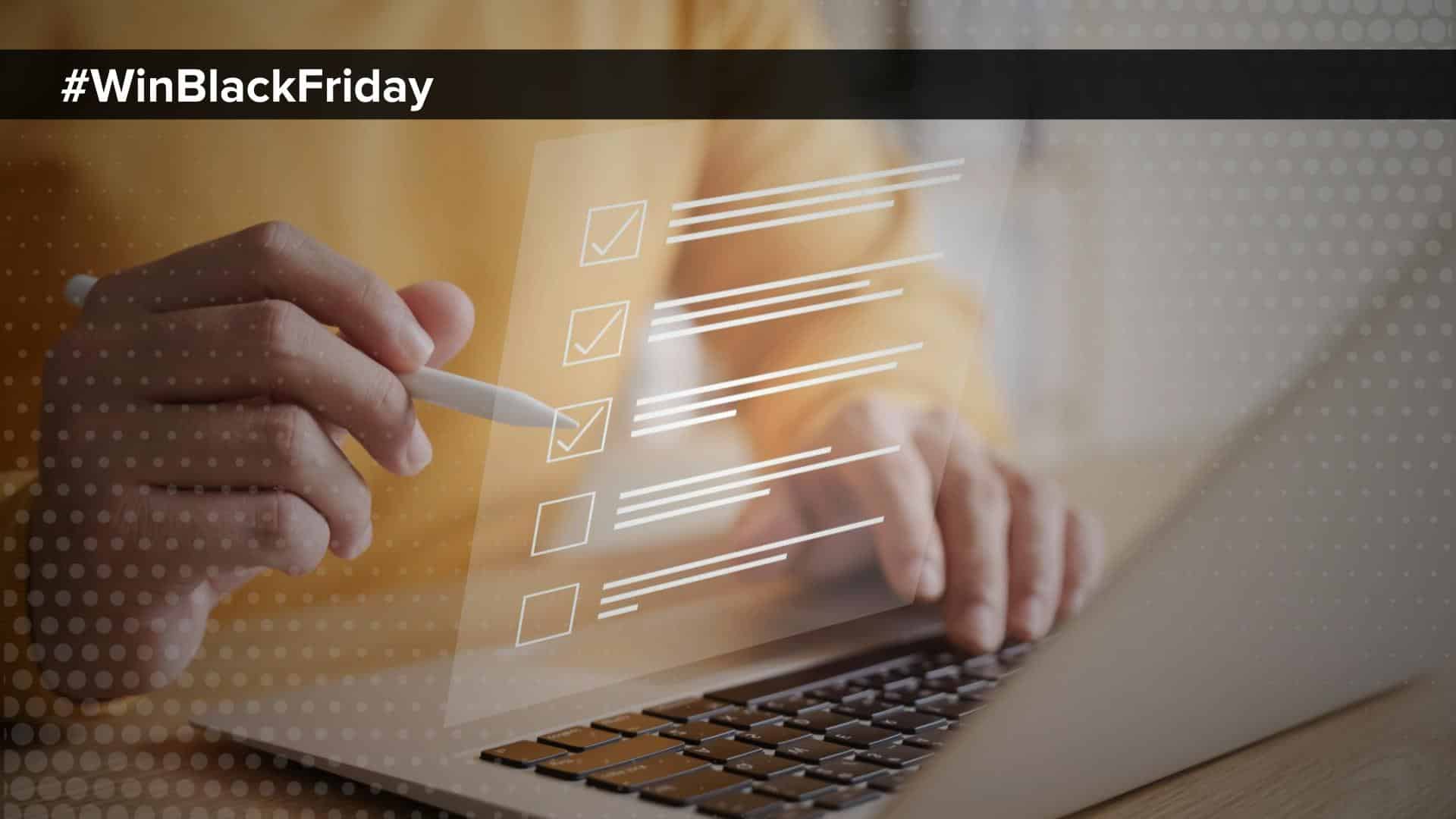 hastag WinBlackFriday person checking things off a list with computer open