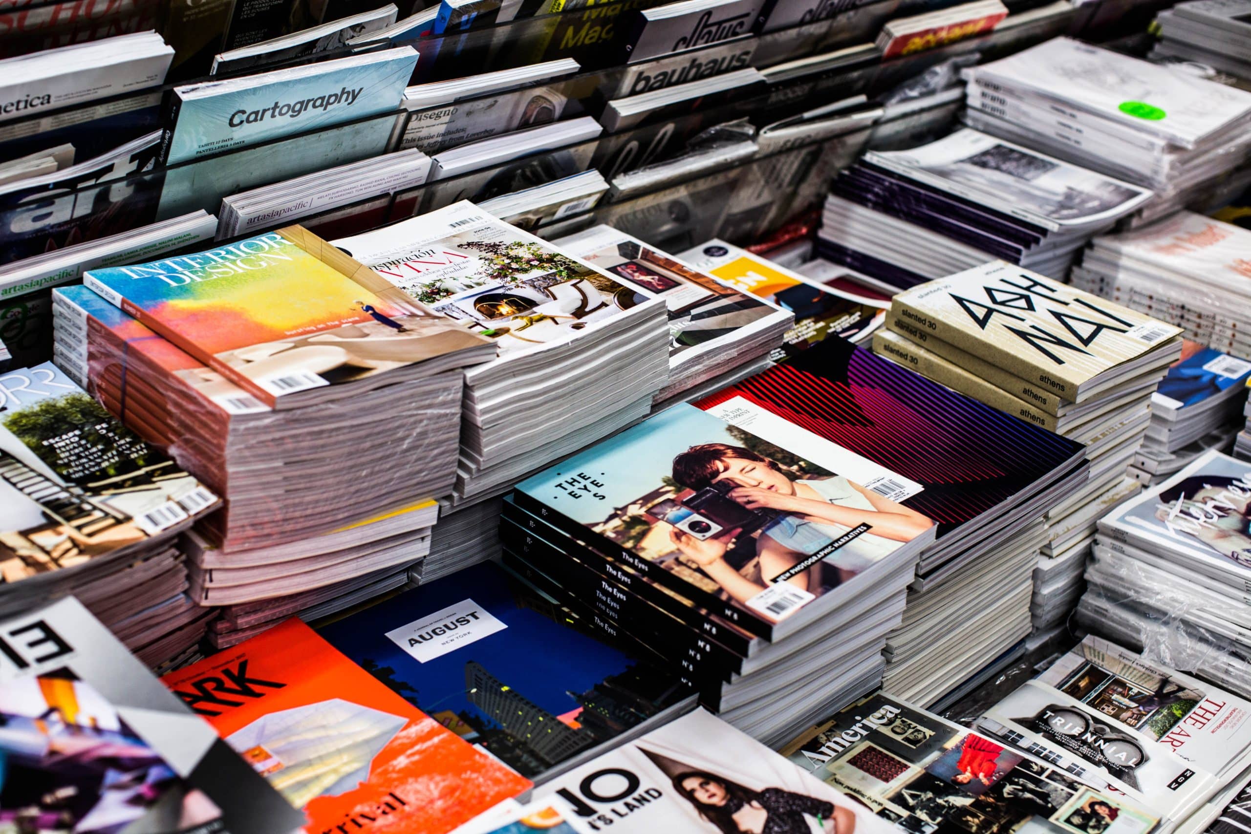 Hundreds of books stacked neatly on a table