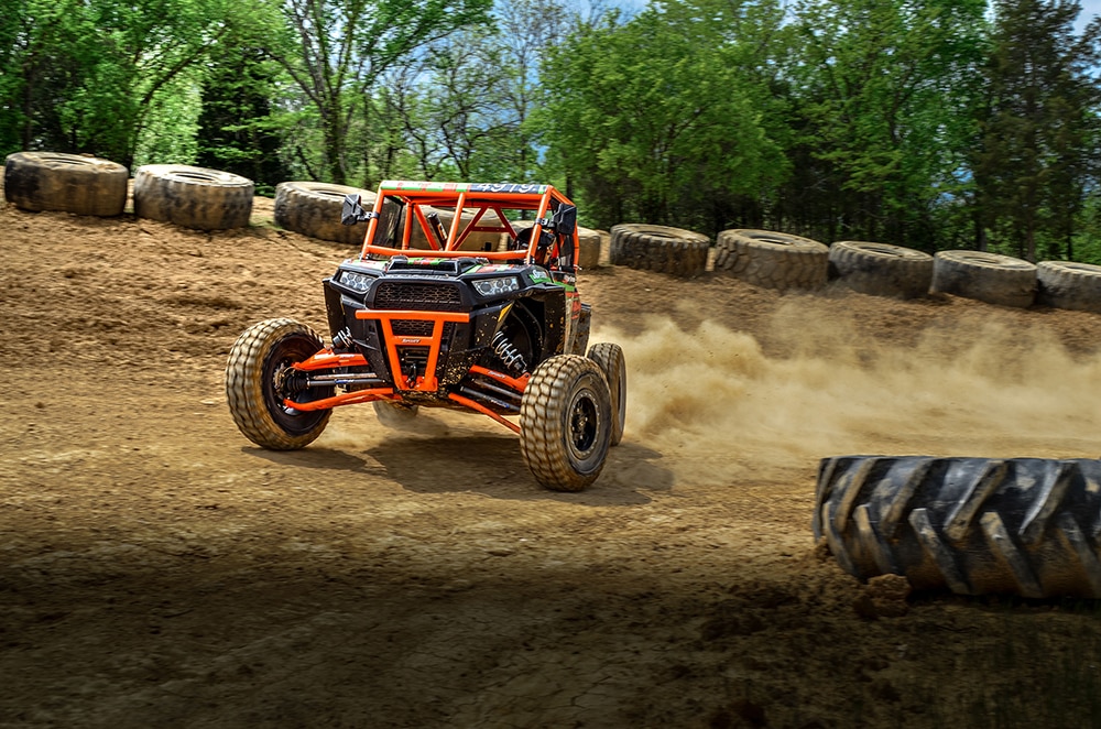 SuperATV Case Study orange atv driving in sand