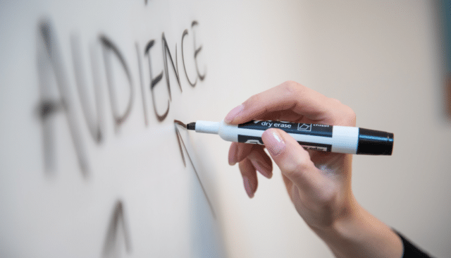 customer mindset - "audience" written on whiteboard with black marker 